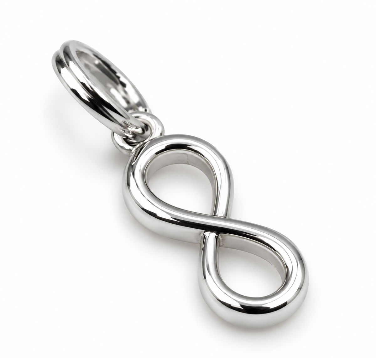 Angled view of solid sterling silver infinity pendant with polished curves and split-ring attachment.