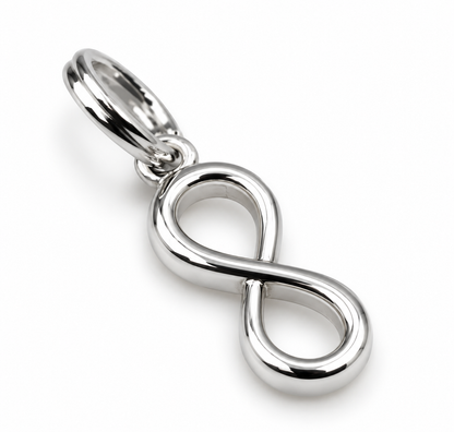 Angled view of solid sterling silver infinity pendant with polished curves and split-ring attachment.